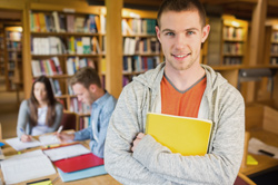 smiling male student taking part in career planning course for researchers